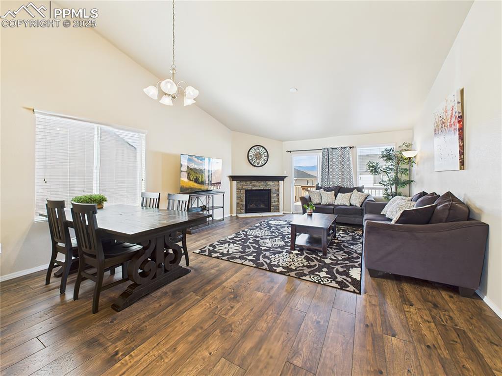 Image 7 of 50: A full view of the kitchen, dining, and living areas showcases the home’s m
