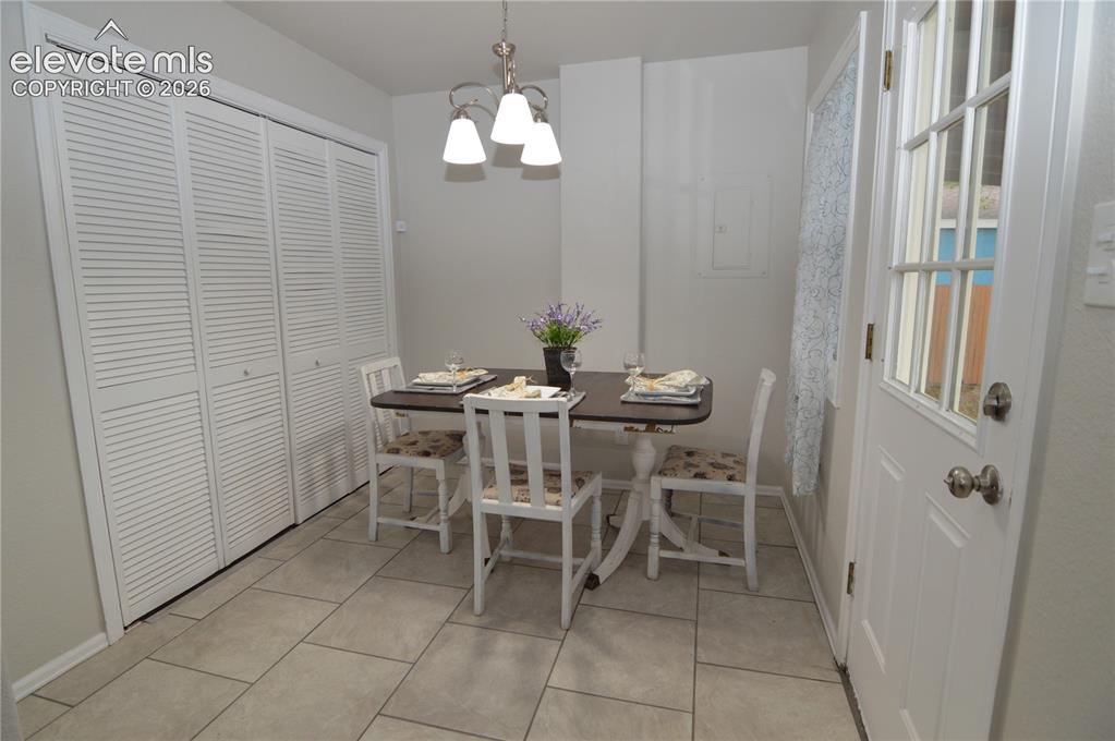 Image 11 of 23: The dining room is just off the kitchen. With the back door, you can walk o