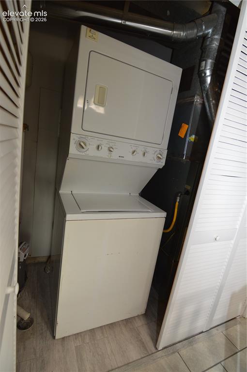 Image 12 of 23: A stackable washer & dryer are included in "as is" condition.