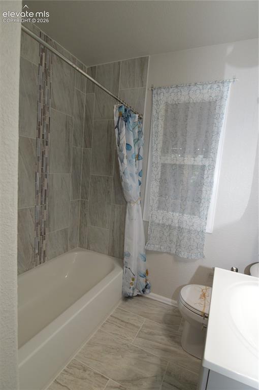 Image 13 of 23: The bathroom has been fully remodeled with custom tile in the shower. 