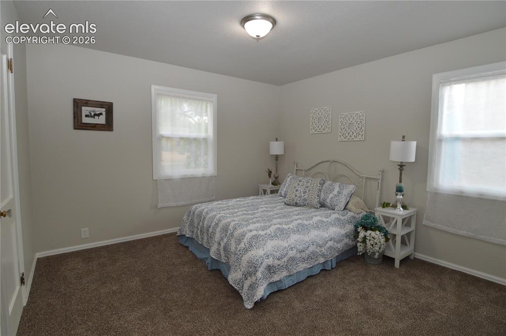 Image 15 of 23: The primary bedroom has plenty of space for a bedroom set.