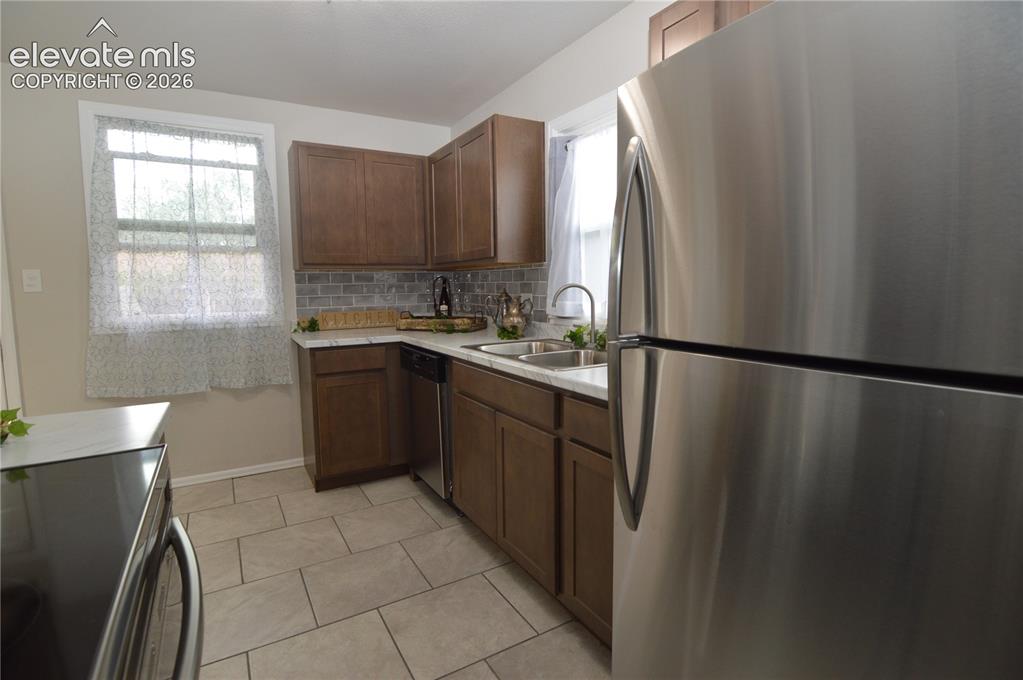 Image 6 of 23: Plenty of countertop space and cabinets in this new kitchen.