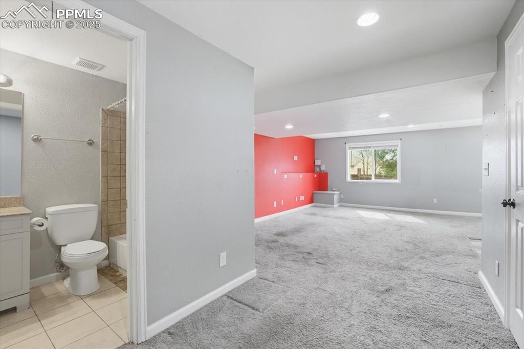 Image 30 of 44: Lower level full bathroom.