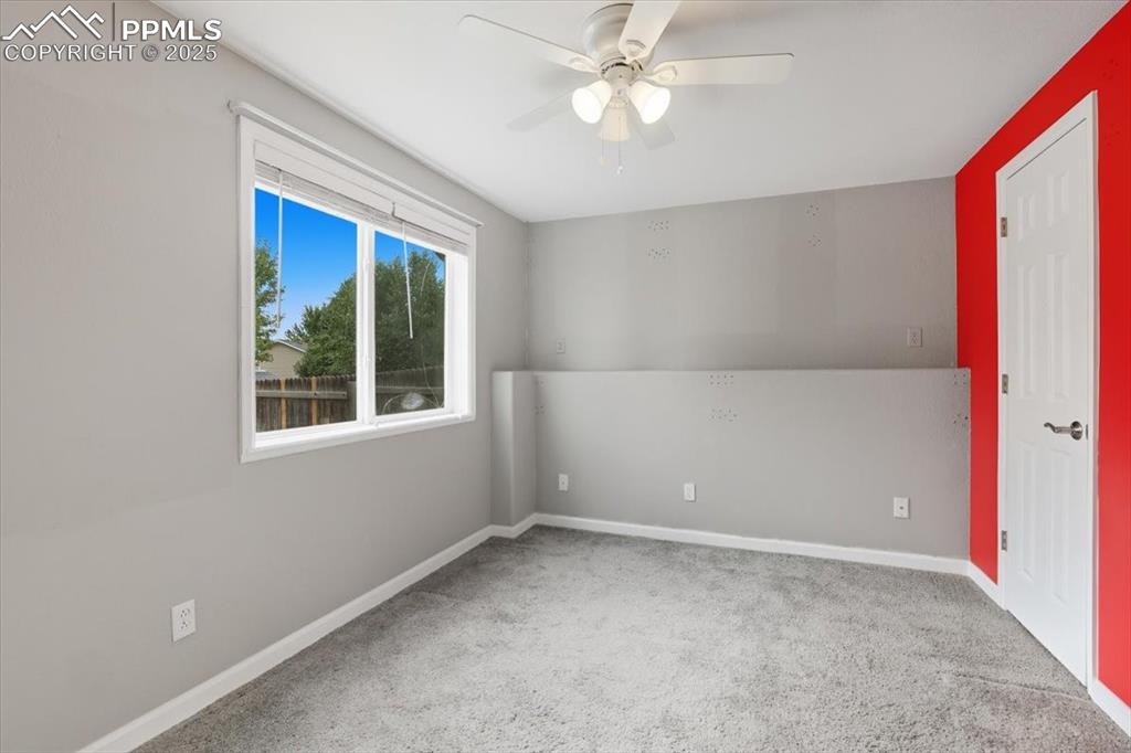 Image 32 of 44: Lower level bedroom.