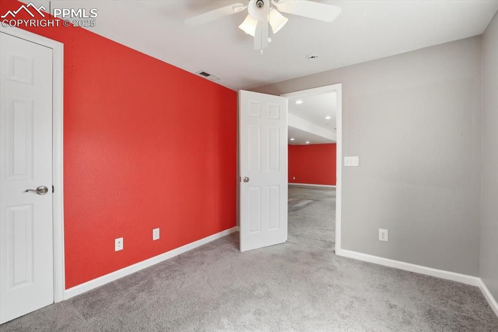 Image 33 of 44: Lower level bedroom.