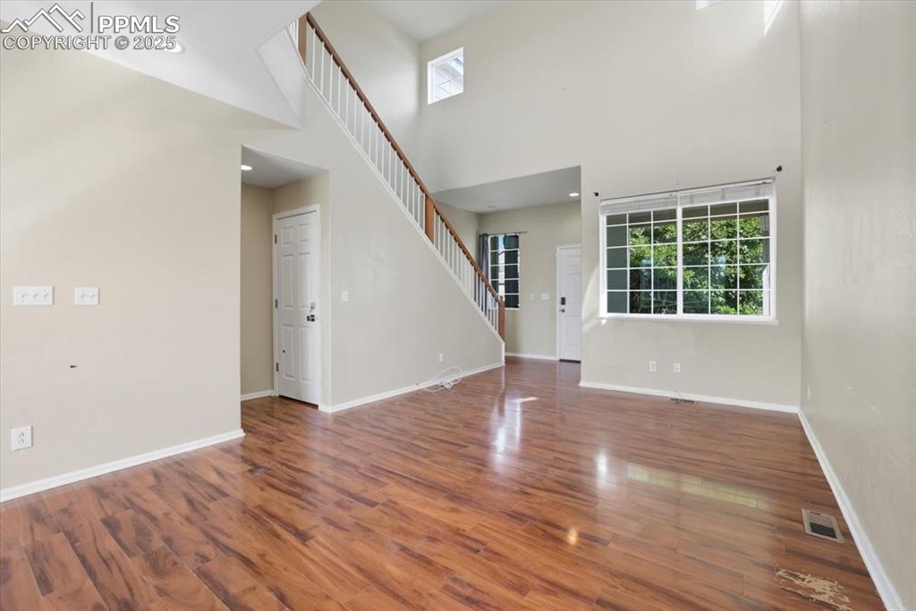 Image 4 of 44: Living room with high ceilings.