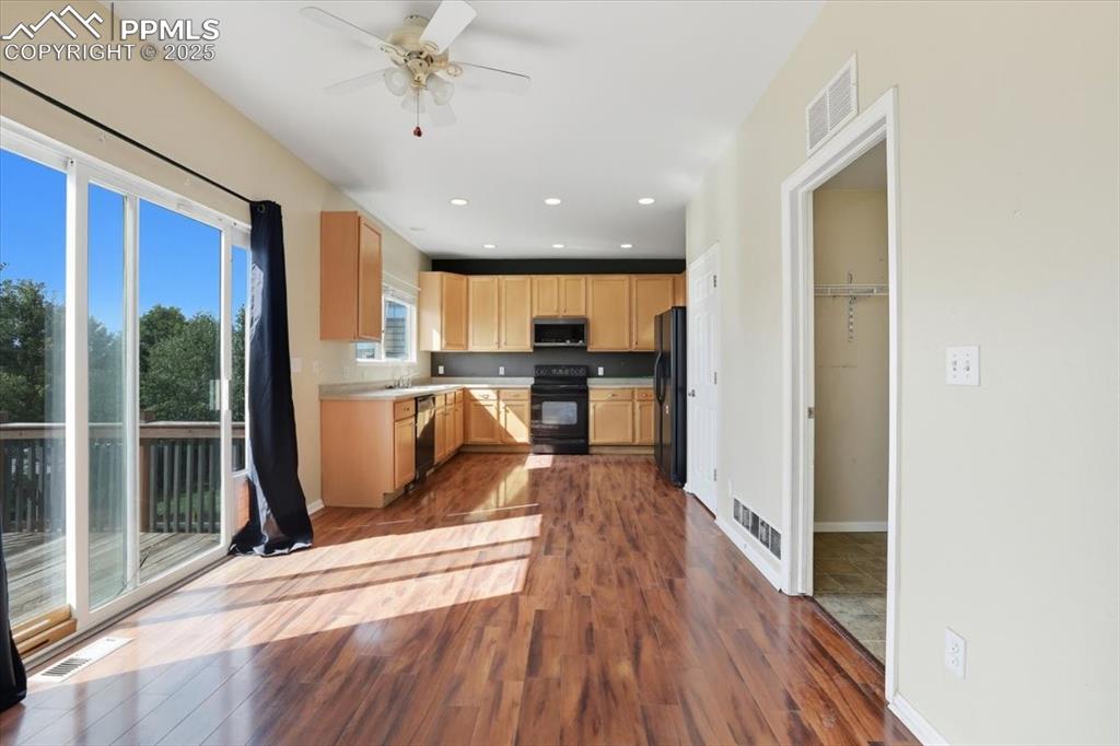 Image 9 of 44: Dining area opens to the kitchen.