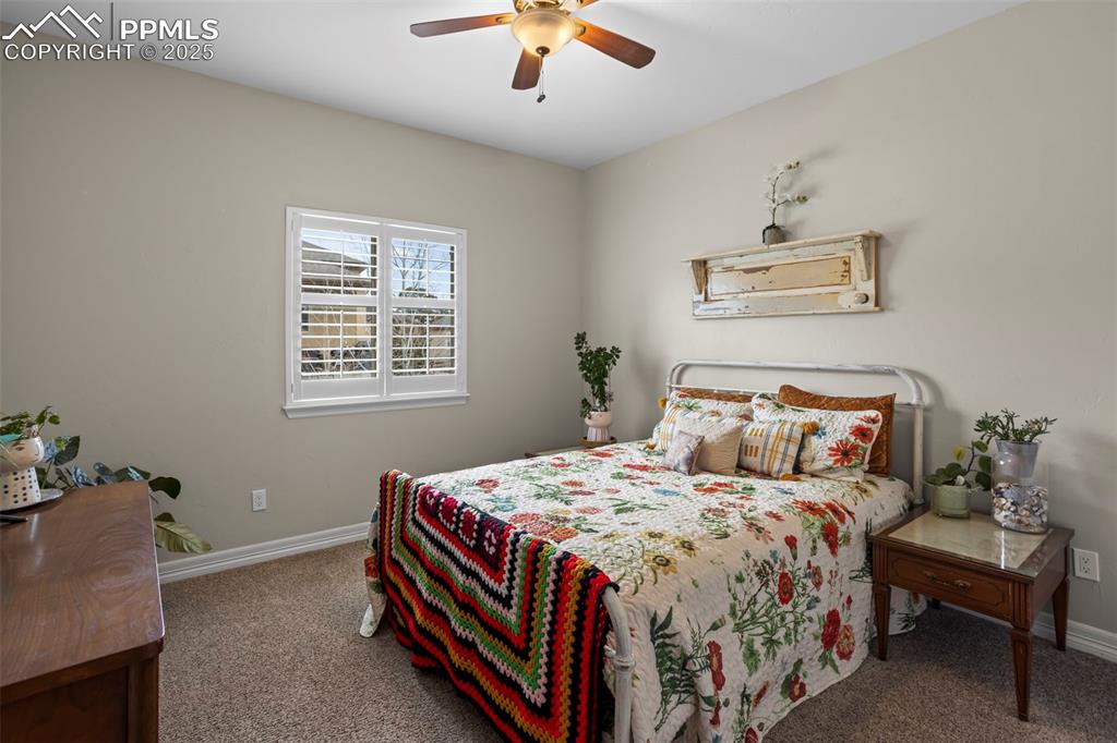 Image 19 of 47: Bedroom featuring baseboards, carpet floors, and a ceiling fan