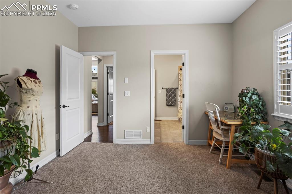Image 25 of 47: Office featuring visible vents, carpet flooring, and baseboards
