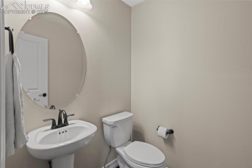 Image 27 of 47: Bathroom with a sink and toilet