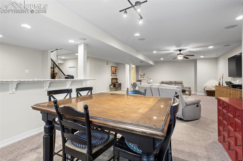 Image 30 of 47: Dining area with recessed lighting, baseboards, light carpet, and ceiling f