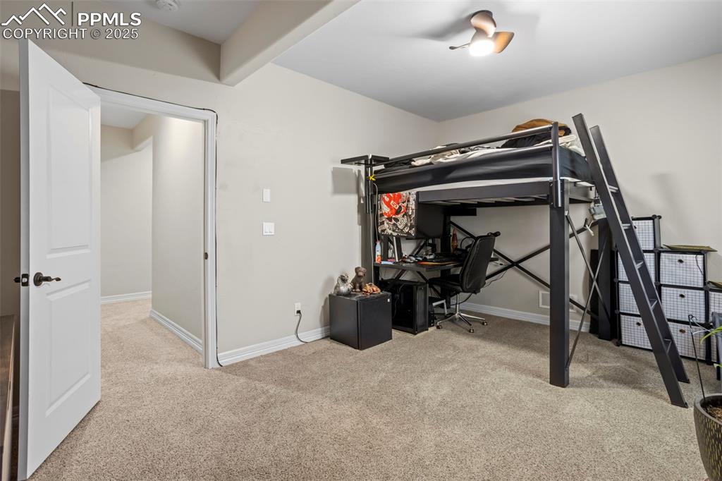Image 35 of 47: Carpeted bedroom with baseboards