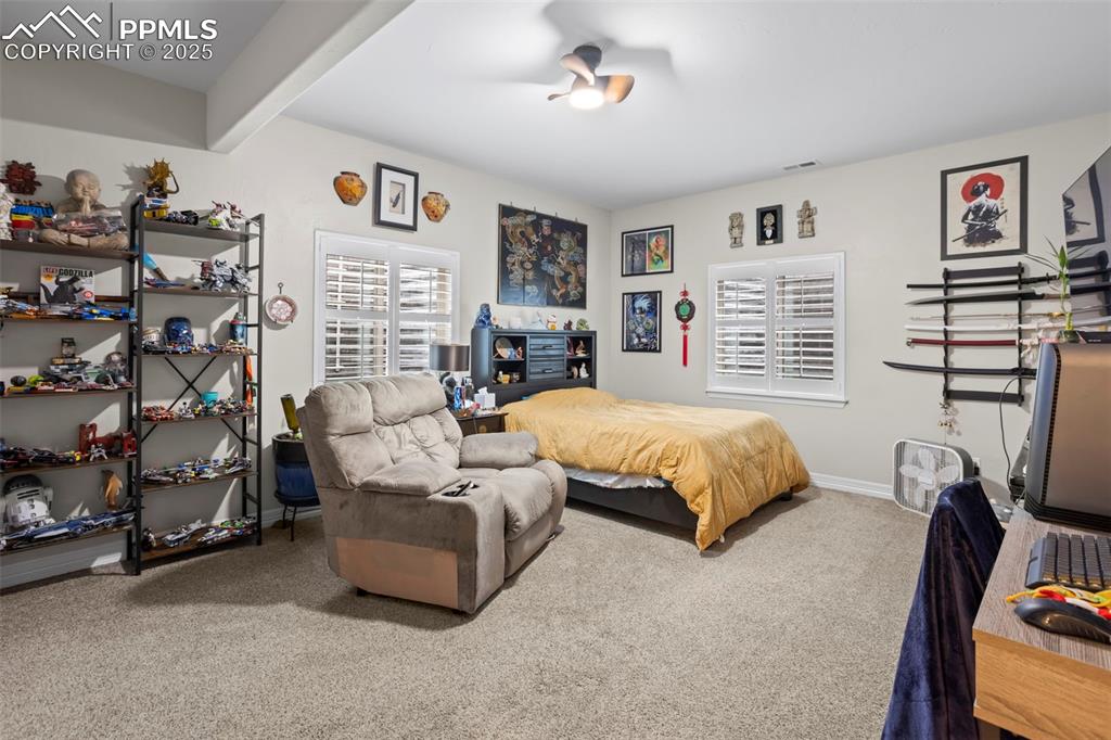 Image 36 of 47: Bedroom with visible vents, baseboards, and carpet