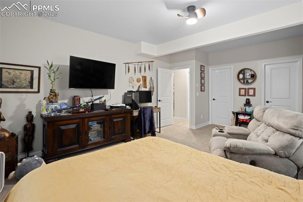 Image 37 of 47: Carpeted bedroom with baseboards