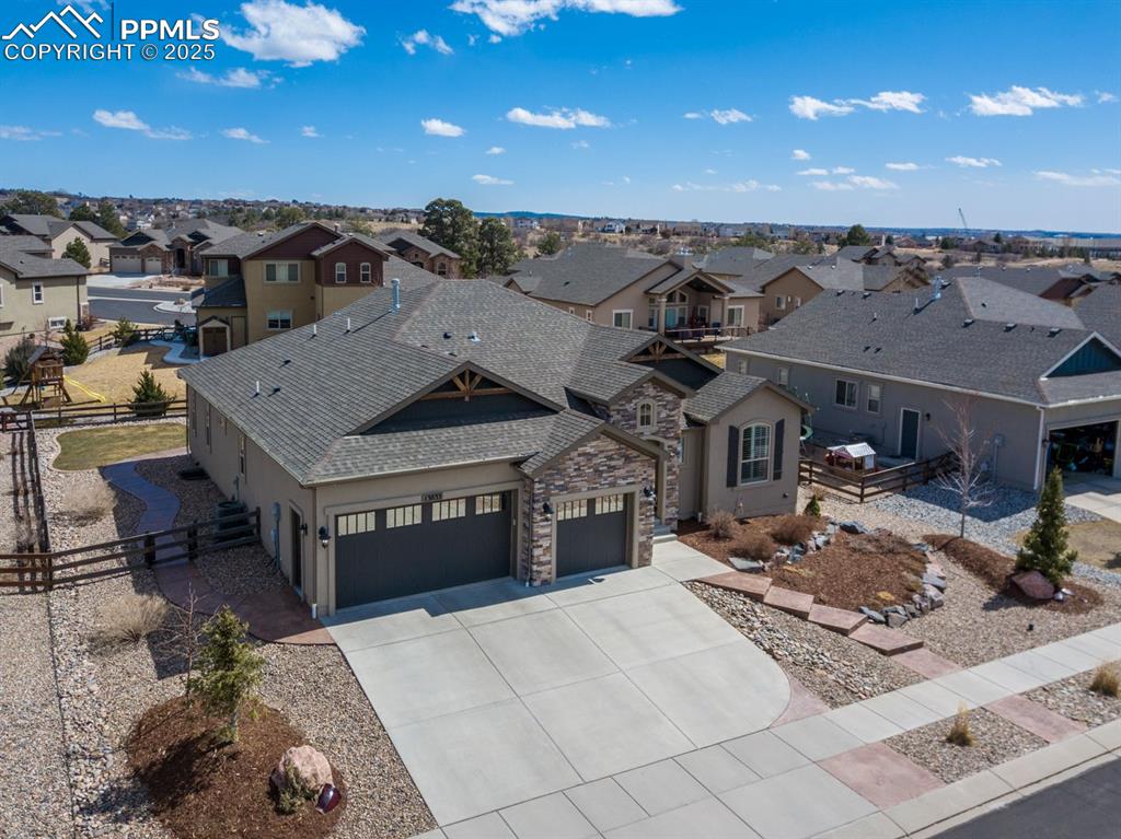 Image 43 of 47: View of front of house featuring fence, roof with shingles, concrete drivew