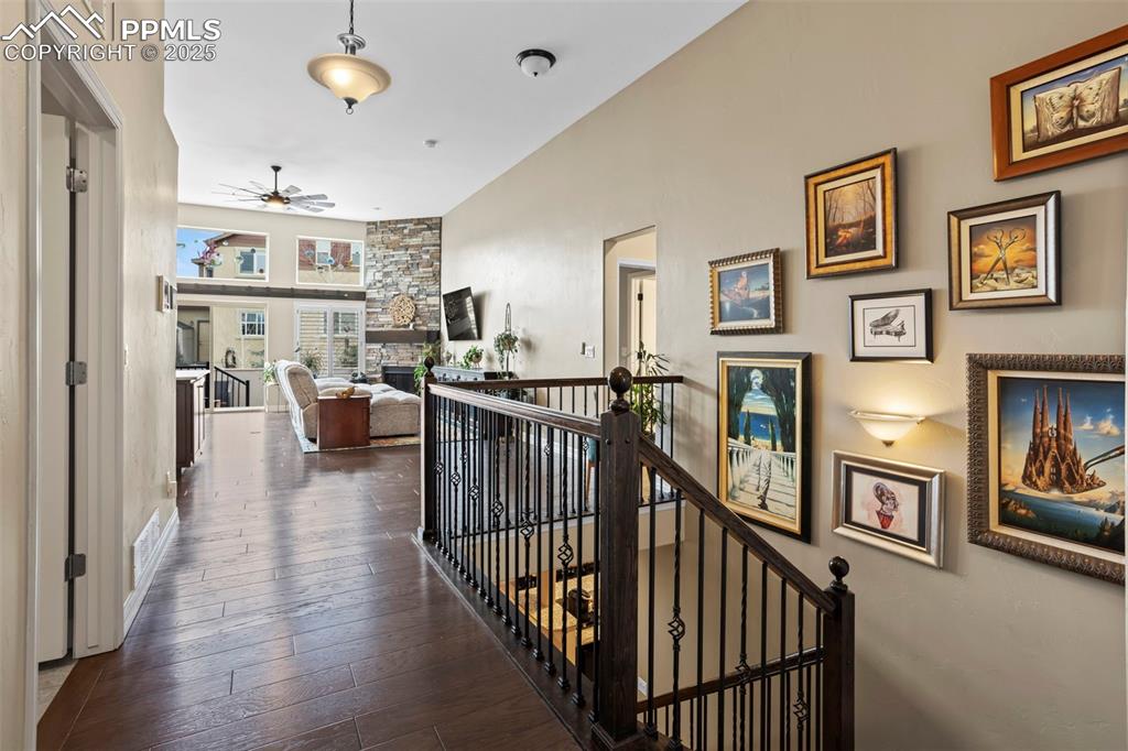 Image 5 of 47: Hallway with hardwood / wood-style flooring and an upstairs landing
