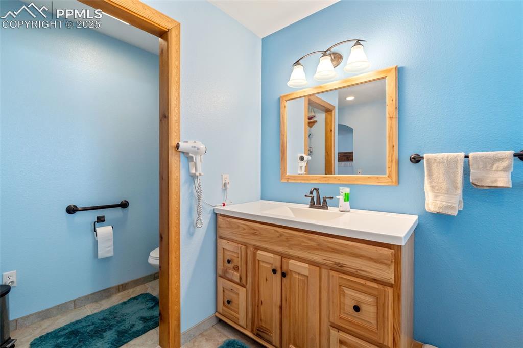 Image 13 of 38: Bright master bathroom with upgraded details