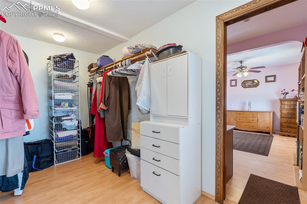 Image 16 of 38: Large walk-in closet with ample storage