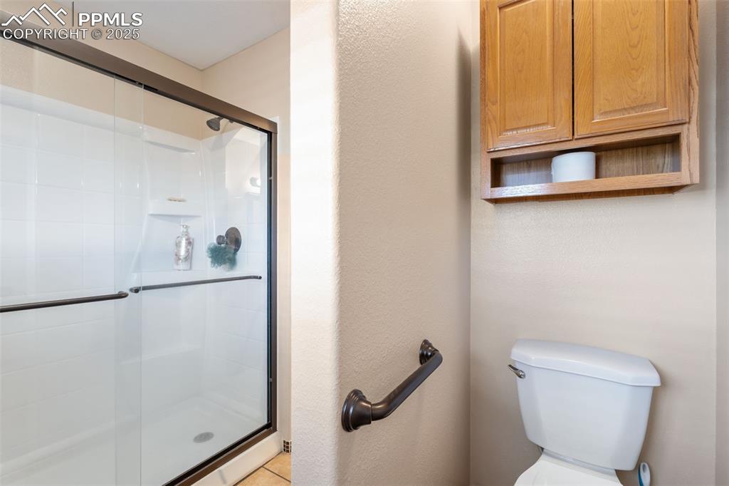 Image 19 of 38: Additional full bath with walk in shower
