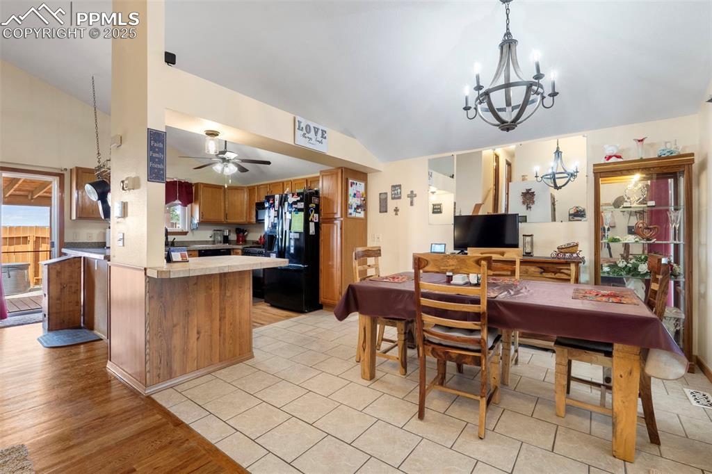 Image 5 of 38: Open dining area with easy flow to kitchen and living spaces