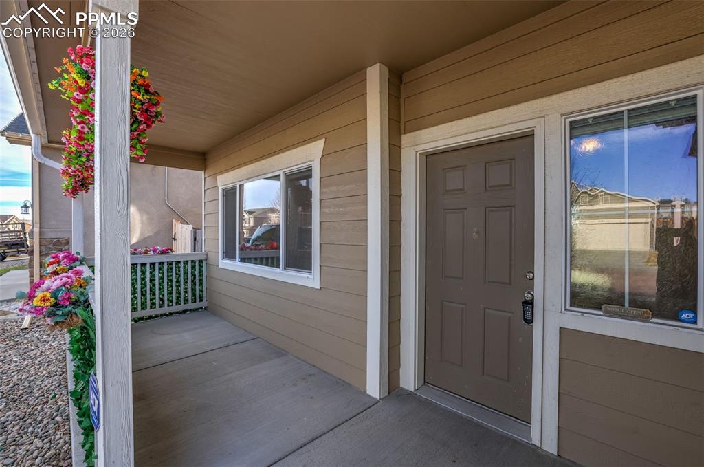 Image 4 of 39: Entrance to property with a porch