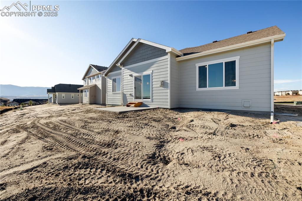 Image 2 of 40: Rear view of property with a patio area