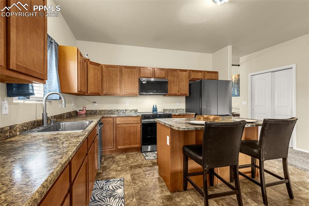 Image 10 of 28: New single basin sink was installed 2025 and appliances are Samsung Bespoke