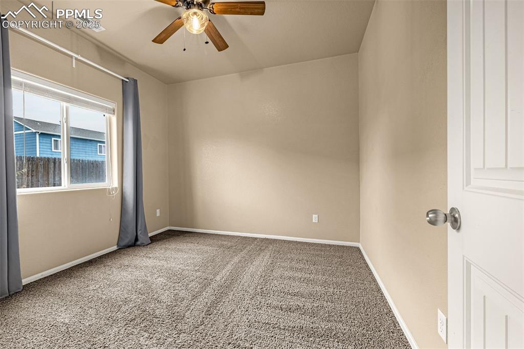 Image 19 of 28: 2n Bedroom with large window, high ceilings and large walk-in closet.