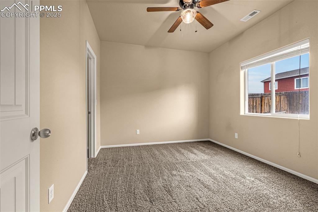 Image 21 of 28: 3rd Bedroom with large window, high ceilings, large walk-in closet. 