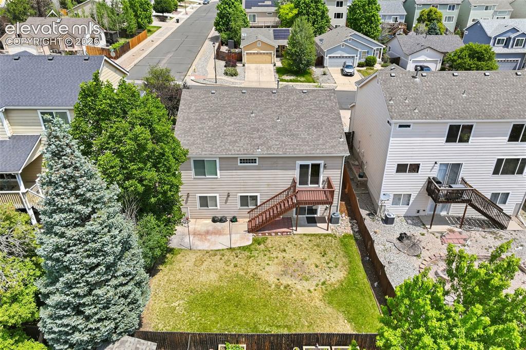 Image 36 of 45: Residential neighborhood featuring varied architectural styles, mature tree
