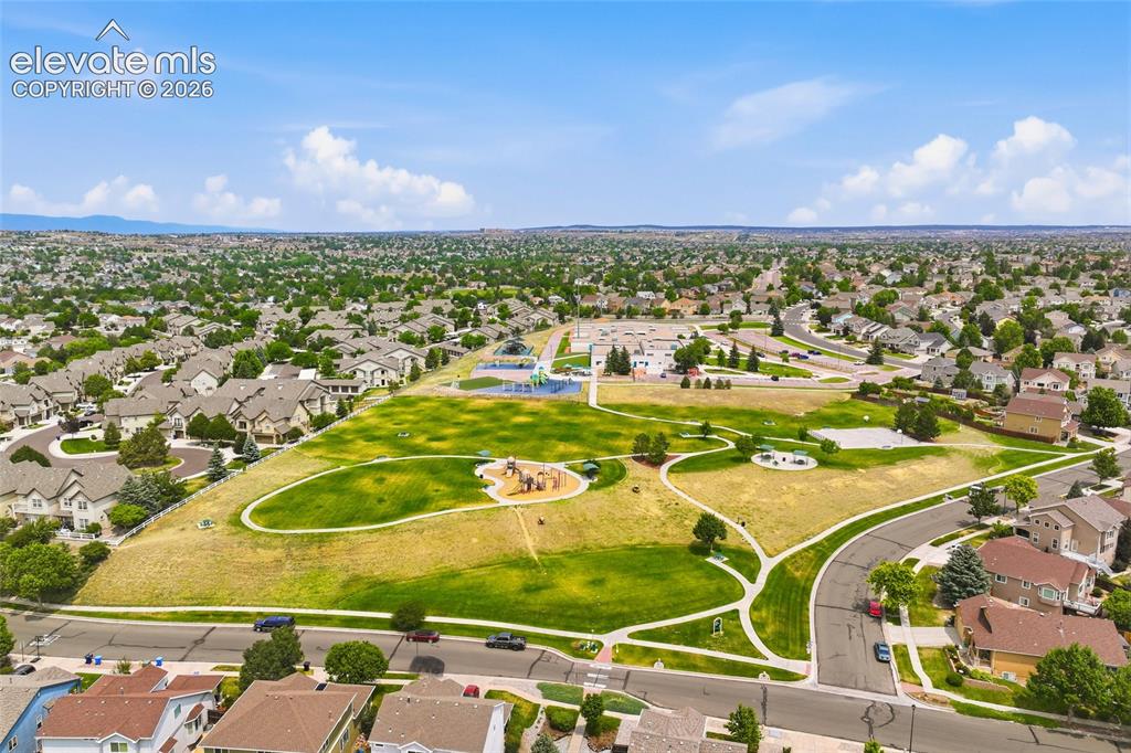Image 41 of 45: Expansive residential neighborhood featuring detached homes and mature tree