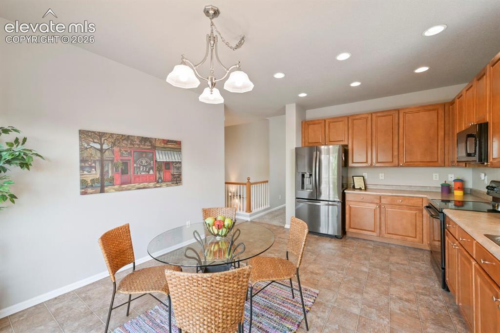 Image 9 of 45: Carpeted interior room featuring French doors, a built-in ceiling fan with 