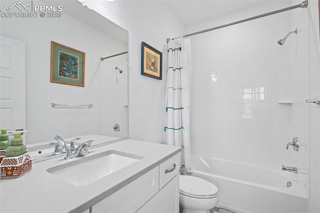Image 22 of 37: Bedroom featuring light colored carpet, a closet, and a ceiling fan