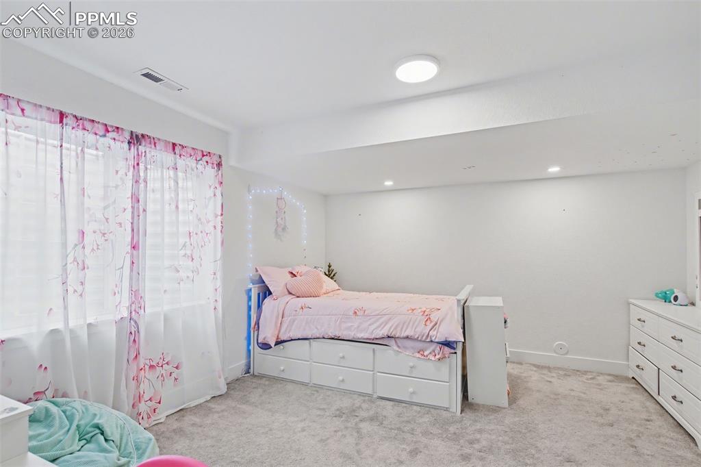 Image 24 of 37: Bathroom featuring vanity and shower / tub combo with curtain