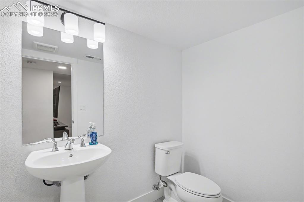 Image 33 of 37: Dining room featuring light carpet and recessed lighting