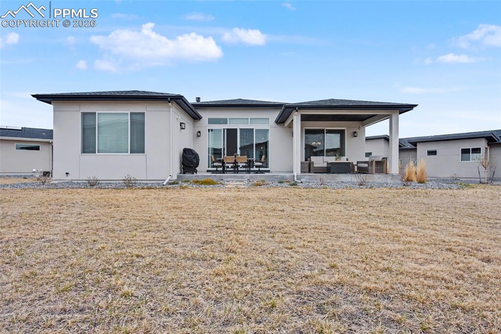 Image 36 of 37: View of patio / terrace featuring an outdoor living / dining area
