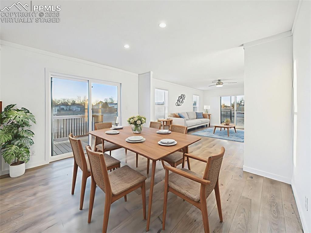 Image 12 of 50: Virtually Staged Enjoy meals by the sliding glass door in this light-filled
