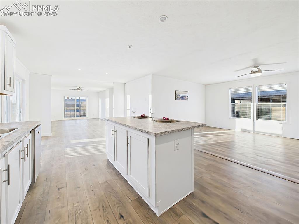 Image 20 of 50: The open-concept design provides clear sightlines from the kitchen into bot