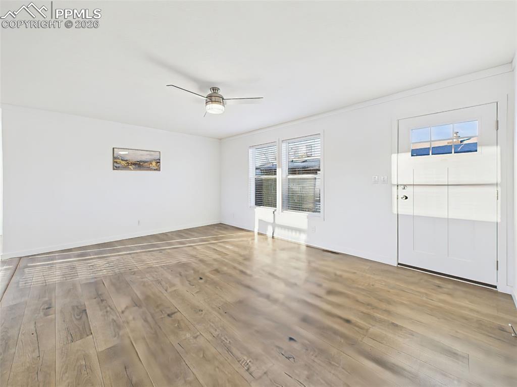 Image 25 of 50: Open and flexible, this front living space offers great natural light and e