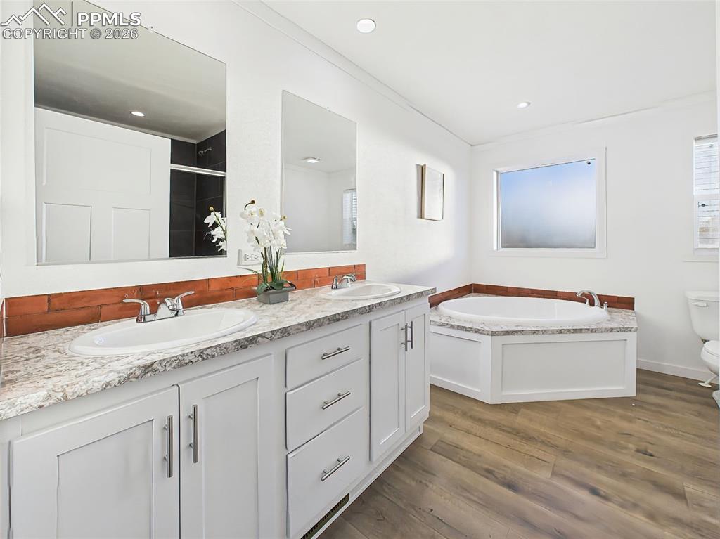 Image 29 of 50: Featuring a 5-piece design, this spacious bath includes a dual-sink vanity,