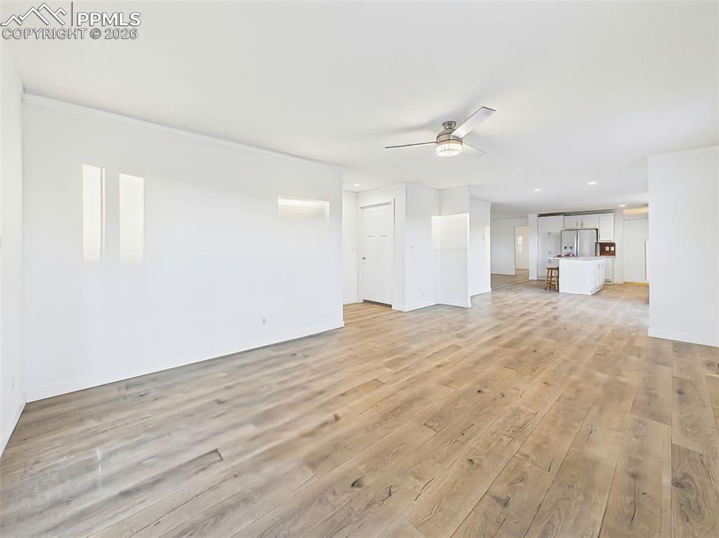 Image 3 of 50: This additional living zone features natural light, neutral finishes, and a