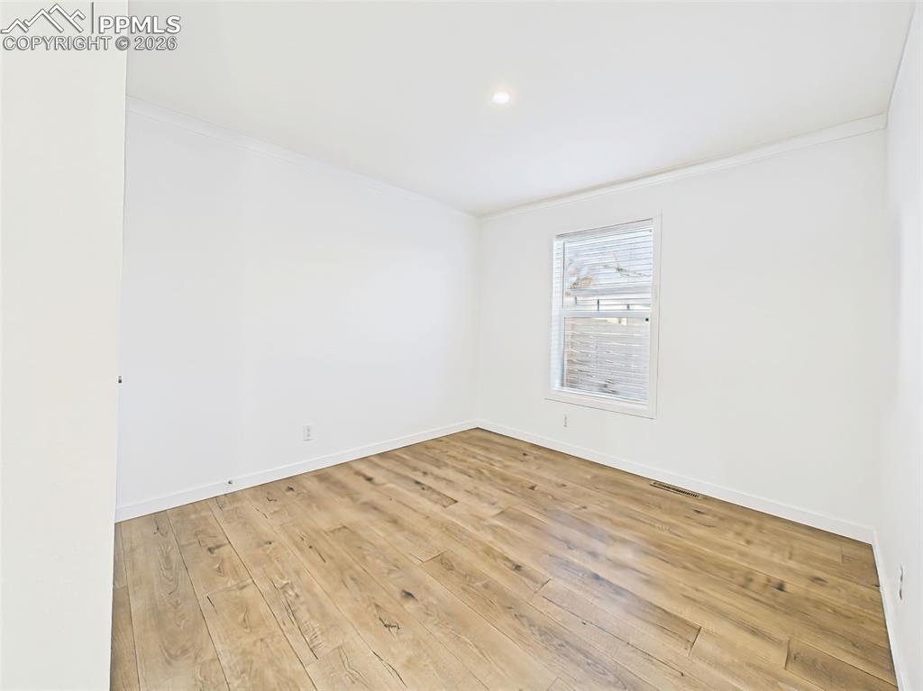 Image 34 of 50: A clean, neutral space ready to accommodate a guest room, nursery, or offic