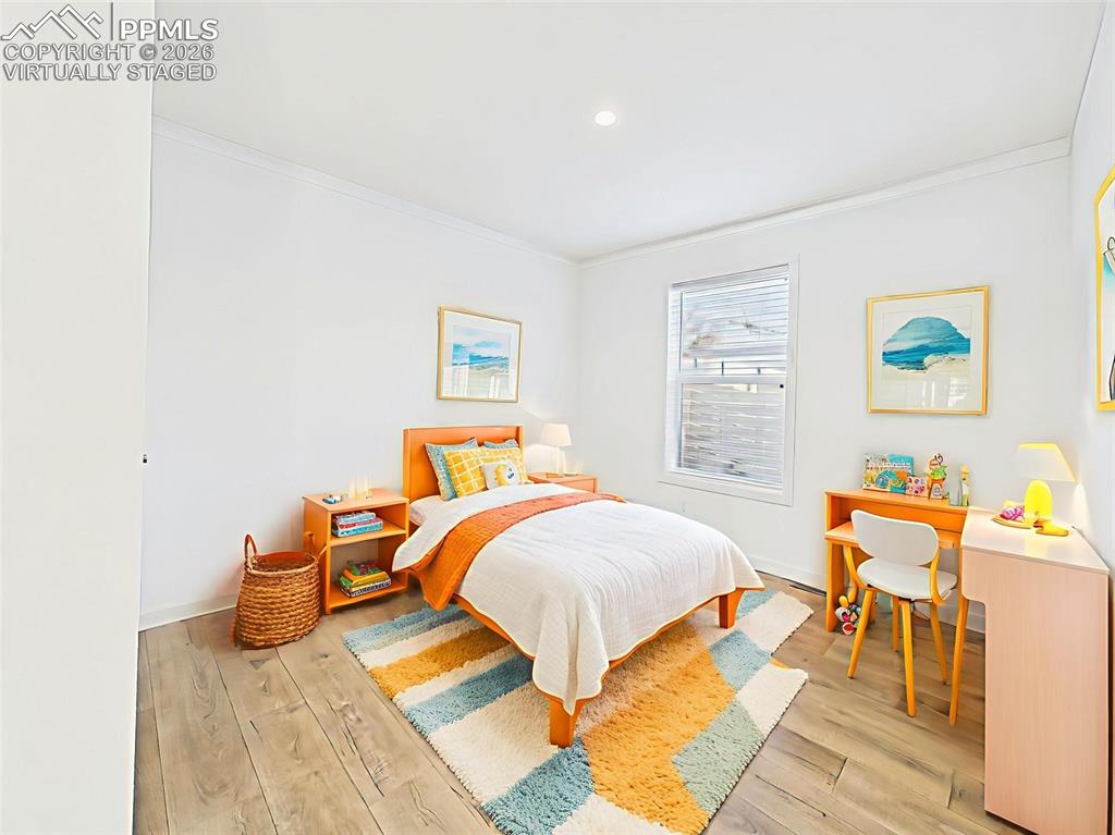 Image 35 of 50: Virtually Staged Bright and cheerful, this 3rd bedroom is styled for versat