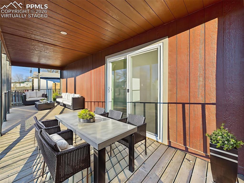 Image 40 of 50: Virtually Staged This expansive covered porch offers ample room for dining