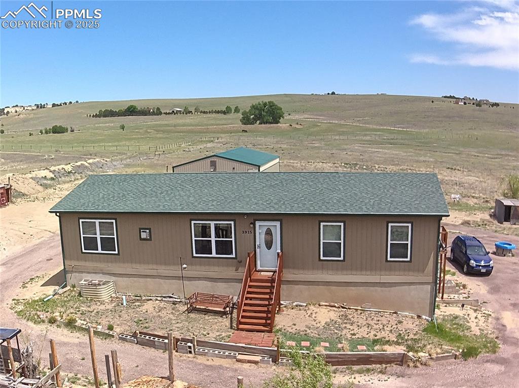 Image 10 of 48: offering wide-open acreage, mountain views, and the true Colorado country-l