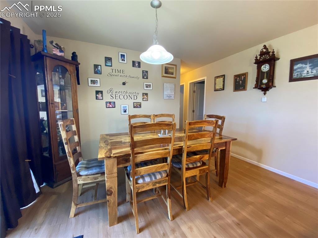 Image 14 of 48: The dining area features direct walkout access to the backyard, enhancing i