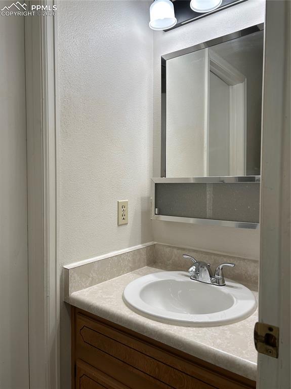 Image 16 of 22: Hall 1/2 bath 