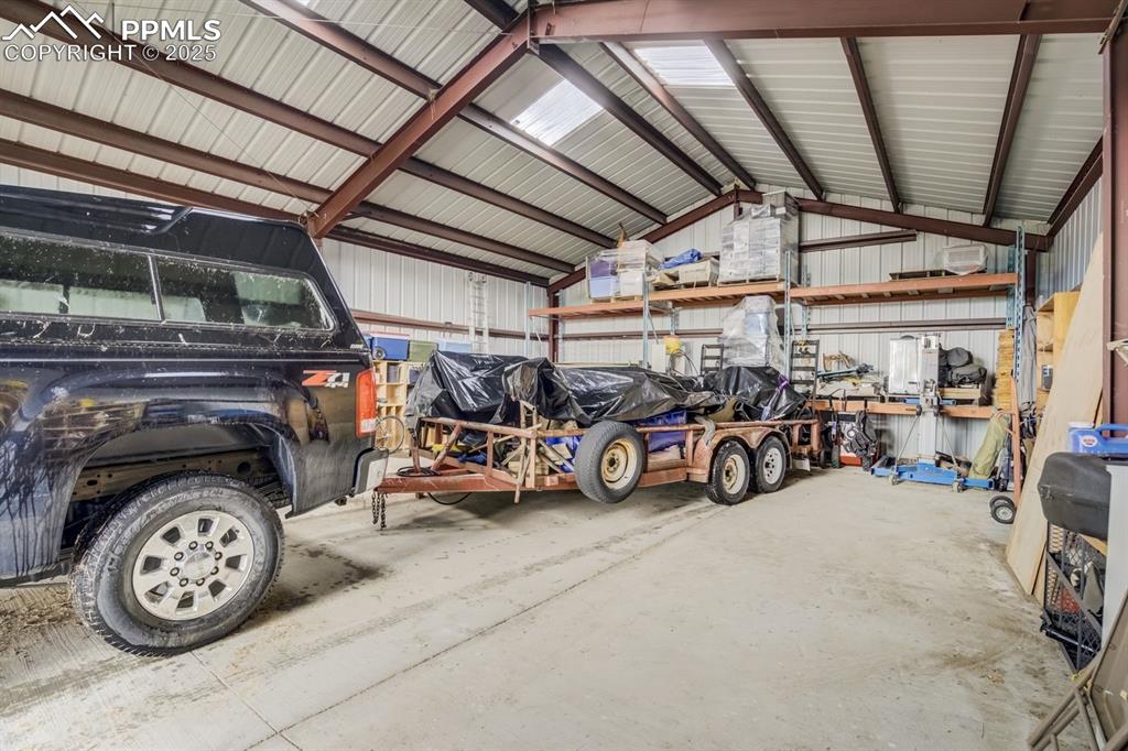 Image 39 of 43: Garage with metal wall