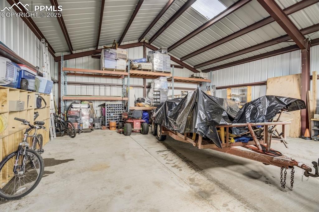 Image 40 of 43: Garage with metal wall