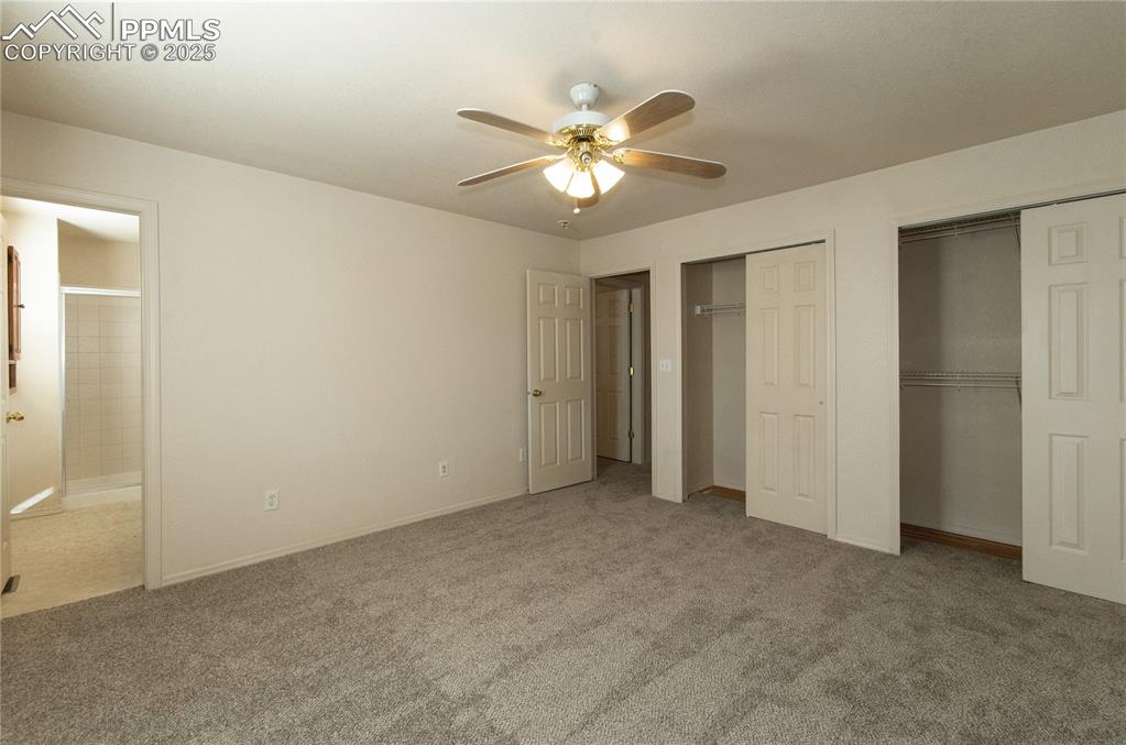 Image 13 of 25: Primary or Master bedroom offering plenty of closet space and adjoining bat